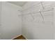 Walk-in closet with shelving and wood flooring at 721 Polo Park Blvd, Davenport, FL 33897