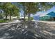 Polo Park Clubhouse and Pro Shop with mature shade trees and parking at 721 Polo Park Blvd, Davenport, FL 33897
