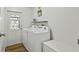 Laundry room featuring a washer and dryer, and door to exterior at 721 Polo Park Blvd, Davenport, FL 33897