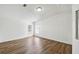 The living room has wood floors and two windows at 721 Polo Park Blvd, Davenport, FL 33897