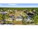 Aerial view of houses situated on lots in a tree-filled rural area at 773 Marion Oaks Pass, Ocala, FL 34473