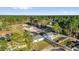 An aerial view showcasing the home and surrounding wooded landscape at 773 Marion Oaks Pass, Ocala, FL 34473