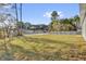Backyard with lush grass and fencing, offering space and privacy at 773 Marion Oaks Pass, Ocala, FL 34473