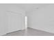 An empty bedroom features tile floors, a large closet, and white walls at 773 Marion Oaks Pass, Ocala, FL 34473
