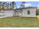 Attractive single-story home with a well-manicured lawn, attached garage, and neutral-colored exterior at 773 Marion Oaks Pass, Ocala, FL 34473