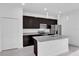Stylish kitchen featuring a large island, granite countertops, stainless steel appliances, and ample cabinet space at 773 Marion Oaks Pass, Ocala, FL 34473