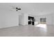 Bright, open-concept living room featuring tile floors and an attached kitchen at 773 Marion Oaks Pass, Ocala, FL 34473