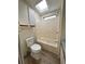 Bathroom featuring a tub and shower combination with adjacent vanity and sink with a skylight at 9000 Us Highway 192 # 835, Clermont, FL 34714