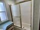 Bathroom featuring a glass-enclosed tub and shower combination with adjacent vanity at 9000 Us Highway 192 # 835, Clermont, FL 34714