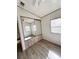 Bedroom featuring plank flooring, ceiling fan, closet with mirrored doors and natural light at 9000 Us Highway 192 # 835, Clermont, FL 34714