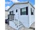 Charming single-story home with a front porch and white siding at 9000 Us Highway 192 # 835, Clermont, FL 34714
