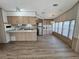 View of the kitchen shows stainless steel appliances and a breakfast bar at 9000 Us Highway 192 # 835, Clermont, FL 34714