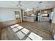 Open-concept layout connects the living room to the kitchen, featuring modern flooring at 9000 Us Highway 192 # 835, Clermont, FL 34714