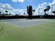 Well-maintained tennis court with lush green surroundings at 9000 Us Highway 192 # 835, Clermont, FL 34714