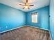 Bedroom featuring neutral carpet and a ceiling fan at 917 Carmillion Ct, Groveland, FL 34736
