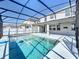 Private screened-in pool area perfect for outdoor entertaining and relaxation at 917 Carmillion Ct, Groveland, FL 34736