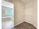 Walk-in closet with carpet and shelving conveniently located off a bathroom at 917 Carmillion Ct, Groveland, FL 34736