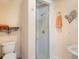 Clean bathroom featuring glass shower, vanity, and decorative wall art at 9501 Tavistock Rd, Orlando, FL 32827