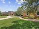 Extensive property with brick drive, well-manicured lawn, and guest house at 9501 Tavistock Rd, Orlando, FL 32827