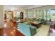 Spacious living room filled with natural light, hardwood floors and stylish furnishings at 9501 Tavistock Rd, Orlando, FL 32827