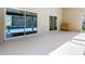 Spacious back porch leading to pool area, featuring convenient cabinetry for outdoor entertaining at 10012 Silver Bluff Dr, Leesburg, FL 34788