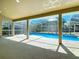 Spacious screened lanai with ample room for seating and entertaining overlooking the pool at 10012 Silver Bluff Dr, Leesburg, FL 34788