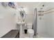 Bathroom with a white pedestal sink, a toilet, and a standing shower stall with white tile at 1024 Harbor Hill St, Winter Garden, FL 34787