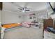 bedroom with a ceiling fan, one window, and two twin beds on top of neutral carpeting at 1024 Harbor Hill St, Winter Garden, FL 34787