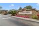 Stoneybrook West Golf Community entrance featuring a stone sign and beautiful landscaping with colorful flowers at 1024 Harbor Hill St, Winter Garden, FL 34787