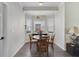 Cozy dining nook with a bay window, modern chandelier, and wood-look flooring at 1024 Harbor Hill St, Winter Garden, FL 34787
