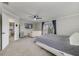 Spacious main bedroom with carpet, a ceiling fan, a sliding glass door to the lanai, and neutral decor at 1024 Harbor Hill St, Winter Garden, FL 34787