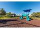 A community playground with a blue slide and canopy, and neighborhood homes in the background at 1024 Harbor Hill St, Winter Garden, FL 34787