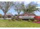 An inviting community sign featuring lush landscaping, and a view of the main town center at 1024 Harbor Hill St, Winter Garden, FL 34787