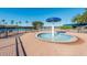 A community splash pad is featured with palm trees and a covered area on a clear day at 1024 Harbor Hill St, Winter Garden, FL 34787