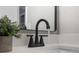 Close-up of a modern bathroom faucet with decorative accents and a clean, minimalist design at 103 Ford Ave, Altamonte Springs, FL 32701