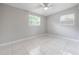 Empty bedroom boasting natural light, ceiling fan, neutral paint, and tile flooring at 103 Ford Ave, Altamonte Springs, FL 32701