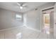 Empty bedroom featuring tile floor, neutral paint, natural light and attached bathroom at 103 Ford Ave, Altamonte Springs, FL 32701