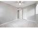 Empty bedroom featuring neutral paint, tile floors, closet, and bright ceiling fan at 103 Ford Ave, Altamonte Springs, FL 32701
