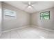 Empty bedroom boasting natural light through the windows and a ceiling fan at 103 Ford Ave, Altamonte Springs, FL 32701