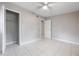 Empty bedroom with closet, tile floors, and a connecting bathroom at 103 Ford Ave, Altamonte Springs, FL 32701