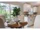 Close-up of dining table near kitchen with natural light and a modern aesthetic at 103 Ford Ave, Altamonte Springs, FL 32701