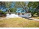 Charming single-story home with a fresh white painted brick and inviting landscaping in the front yard at 103 Ford Ave, Altamonte Springs, FL 32701
