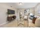 Inviting living room with modern decor, comfortable seating, and an open layout leading to the bedroom at 103 Ford Ave, Altamonte Springs, FL 32701