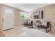 Bright and open living room featuring a tiled floor, stylish decor, and ample natural light from the windows at 103 Ford Ave, Altamonte Springs, FL 32701