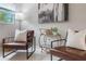 Stylish living room with tiled floors, comfortable seating, and a decorative bar cart for entertaining at 103 Ford Ave, Altamonte Springs, FL 32701