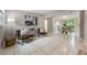 Open-concept living and dining area with tile floors, contemporary furnishings, and plenty of space for entertaining at 103 Ford Ave, Altamonte Springs, FL 32701