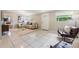 Spacious living room with tile flooring, neutral decor, comfortable seating, and a bright and airy feel at 103 Ford Ave, Altamonte Springs, FL 32701