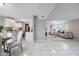 Open-concept layout from dining to living area with tile floors and a seamless flow for entertaining at 103 Ford Ave, Altamonte Springs, FL 32701