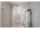 Utility room with water heater, tile floors, and access to other areas of the home at 103 Ford Ave, Altamonte Springs, FL 32701