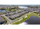 A bird's-eye view of a neighborhood by the lake at 12064 Encore At Ovation Way, Winter Garden, FL 34787